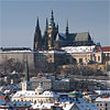 Lesser Town (Mala Strana) covered by snow with Prague Castle and St. Vitus Cathedral above